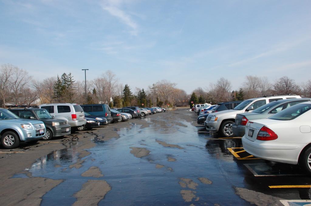 As students pull out of the BHS parking lot, how many will put down their iphones? Photo by Asha Clark.