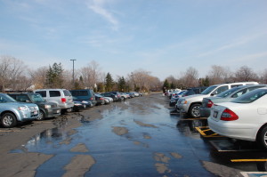 As students pull out of the BHS parking lot, how many will put down their iphones? Photo by Asha Clark.