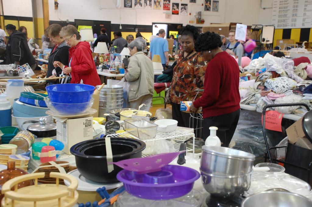 Members of the community browsed kitchenware at the PTO garage sale. Photo by Daniel Sheriff.