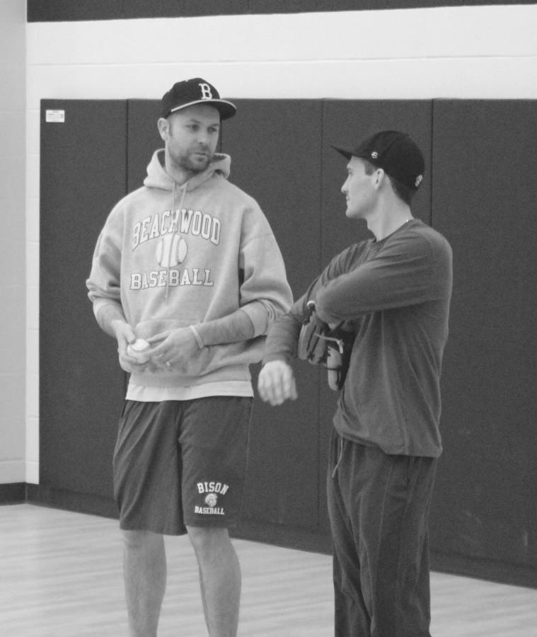 Puskar speaks with assistant Coach Joe Leonette during practice on Feb. 23. Photo by Bradford Douglas.