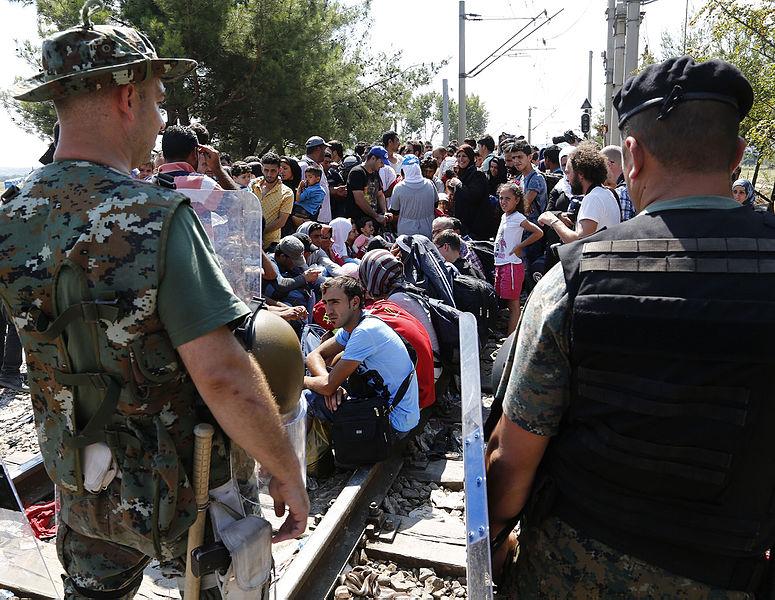 Refugees at border crossing in Macedonia, Aug. 24, 2015. Photo by Dragan Tatic via Wikimedia Commons.