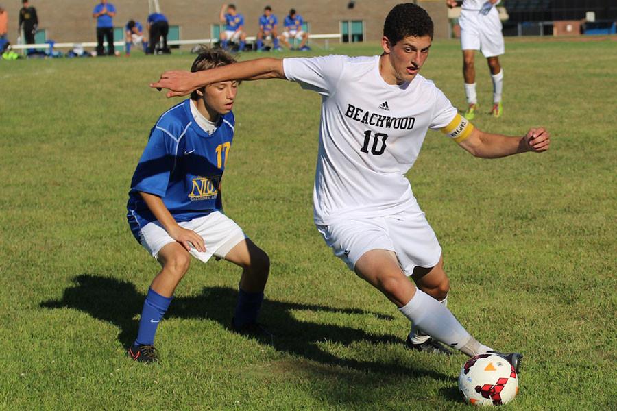 Senior Captain Bagatur Askaryan controls the ball in the game against Notre Dame Cathedral Latin on Aug. 27. The Bison won 6-0. Photo by Bradford Douglas.