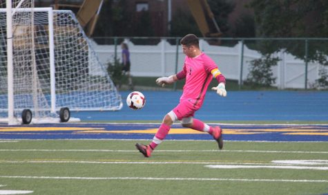 Senior goalie Griffin Davis defends the goal in the season opener against Independence. Photo by Livia Eppell.