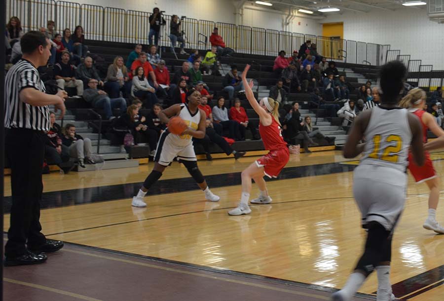 Taylor Royster looks for an opening in the Pirate defense during the Dec. 9 game against Perry. Photo by Julia Charnas.