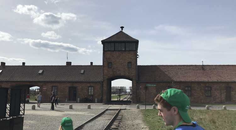 The+exterior+of+Auschwitz+II-Birkenau++hovers+over+the+train+track+that+was+once+used+to+usher+in+thousands+of+Jews+at+once+to+prepare+them+for+gassing.+Photo+by+Max+Alter