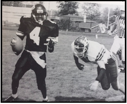 All MAC-8 quarterback Damion Creel evades a JFK
defender on his way to a spectacular 390- yard passing record. Photo from Oculus archives