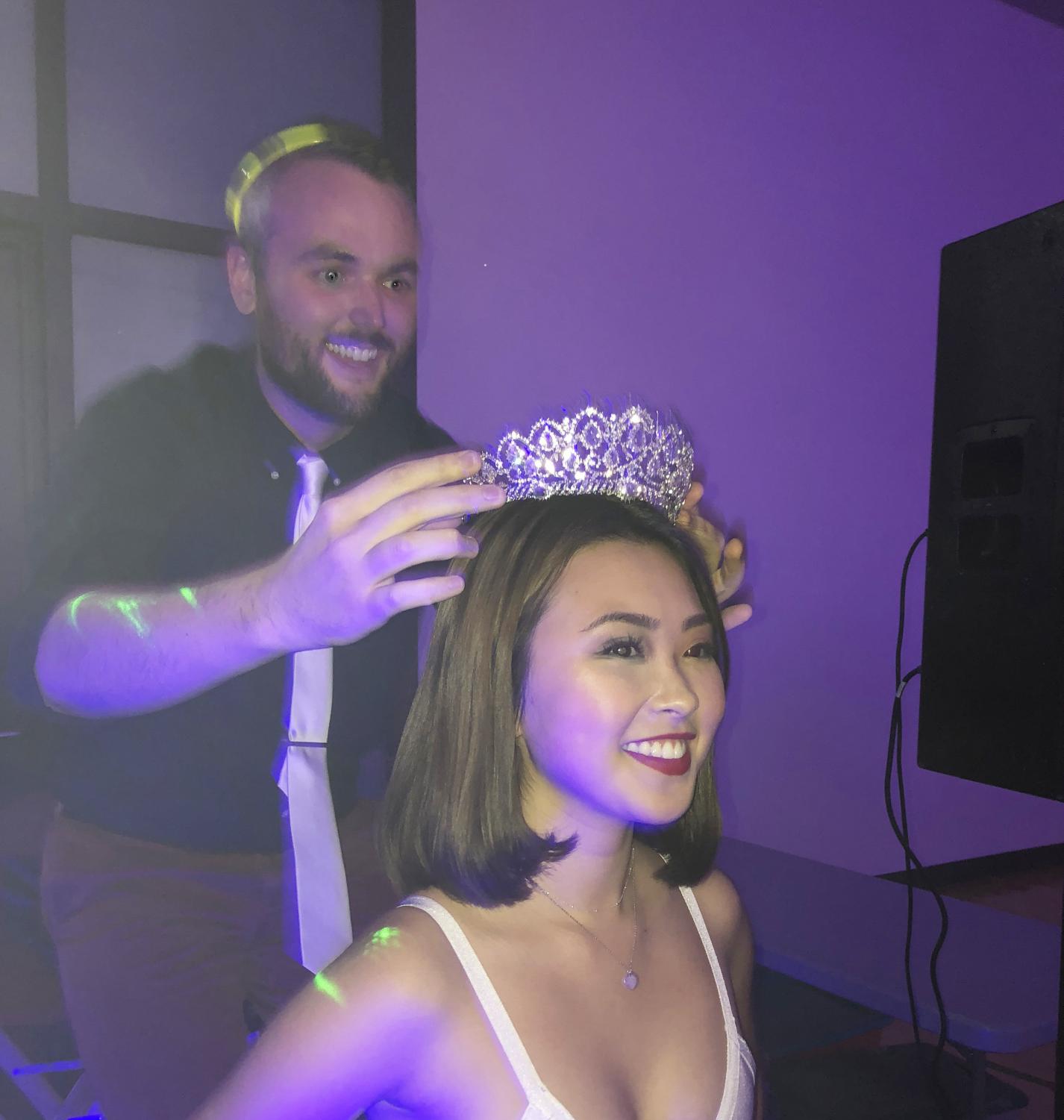 Class of 2019 adviser Alex Paulchell crowns Melody Shen at the Homecoming dance. Photo by Elizabeth Metz.