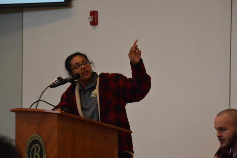 Sophomore Elizabeth Metz presents statistics about mass shootings in the United States. Photo by Emily May.