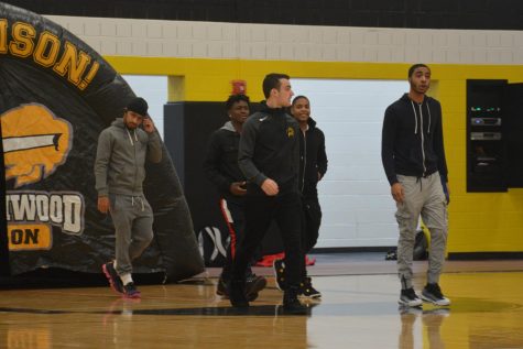 The basketball team walks out at the winter sports pep rally. Photo by Matthew Keyerleber