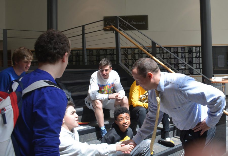 Paul Chase greets students at the high school on Monday, May 20. Photo by Prerna Mukherjee