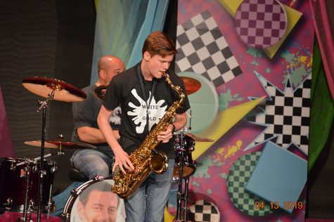 Ben Bosler (Class of 2021) performing with the teacher band at the last in-person White & Gold show in 2019.