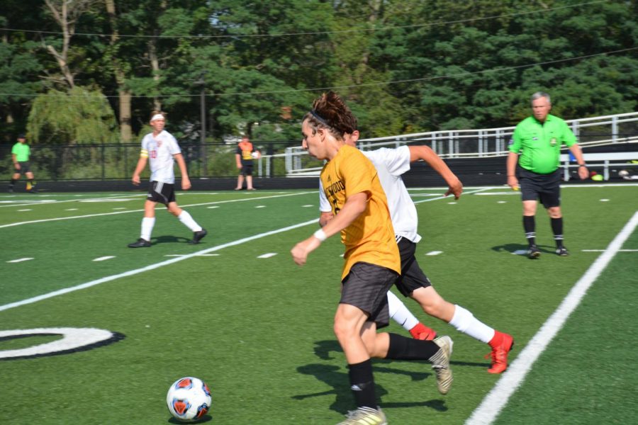 Junior forward Lucca Dallan drives right past a Falcon defender.