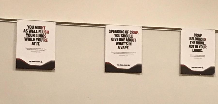 These scatological posters displayed in the main office are intended to dissuade student vaping.