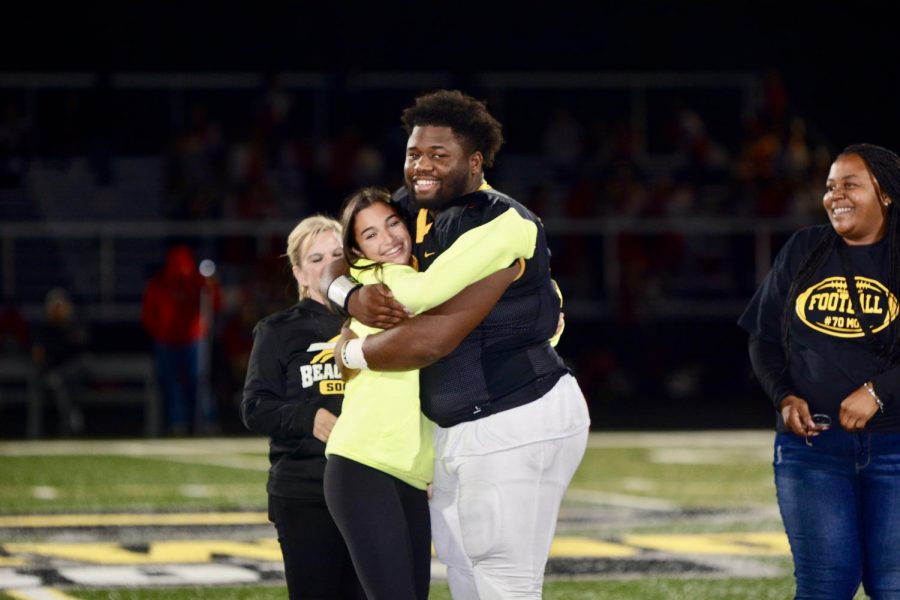 Petti and Roscoe celebrate with a hug after learning they were selected homecoming Queen and King.