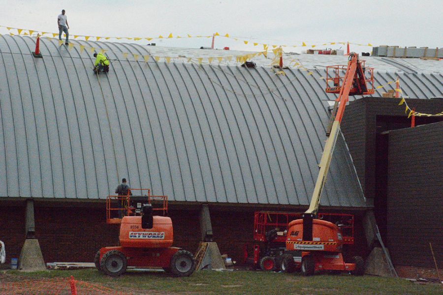 Workers install the new standing seam roof in September. 