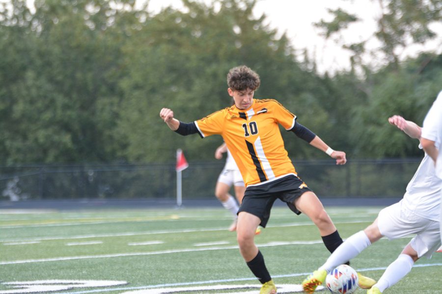 Senior Gui Kliger tries to push past a Cuyahoga Heights defender into open space.