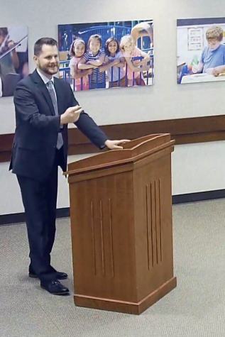 Matthew Brown takes the podium at the March 13 board meeting.