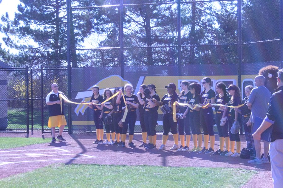 The softball team celebrates the opening of their stadium and their season on April 12. Photo by Ethan Dong