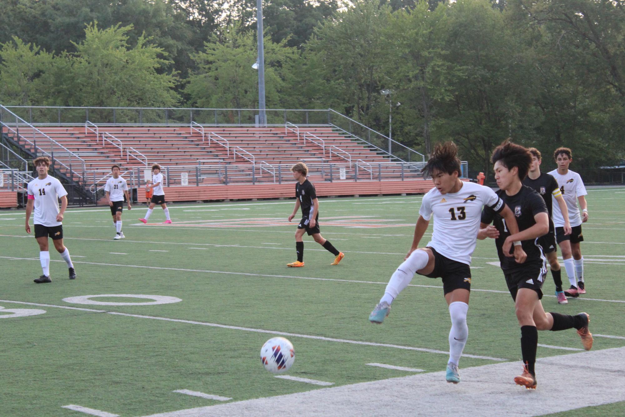 Jonathan Mo fights for control of the ball with a Chagrin defender. 