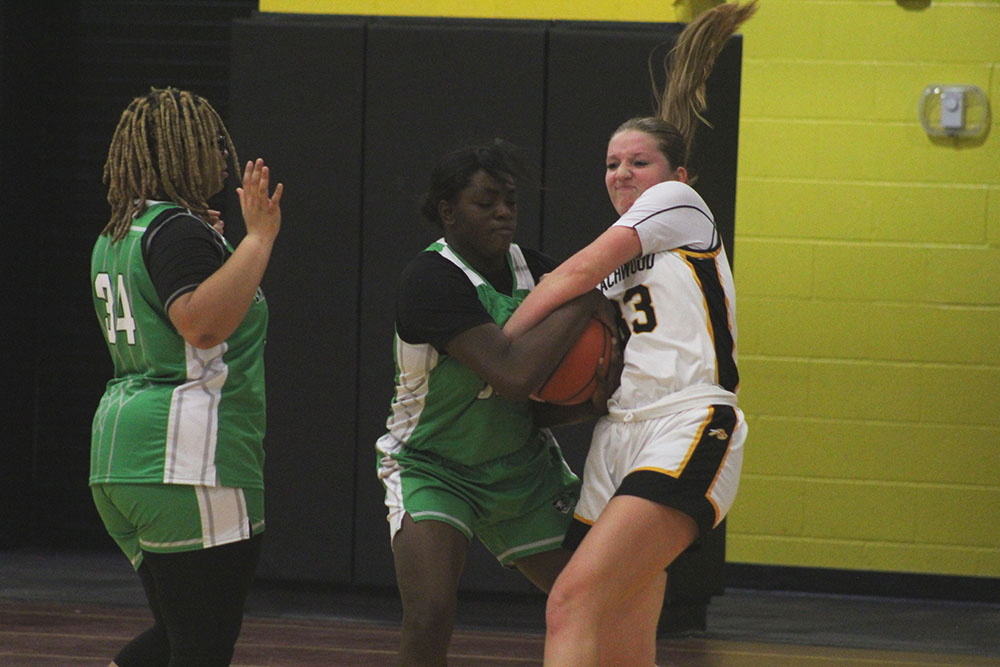 Aschkenasy struggles with a Bedford player for control of a jump ball.
