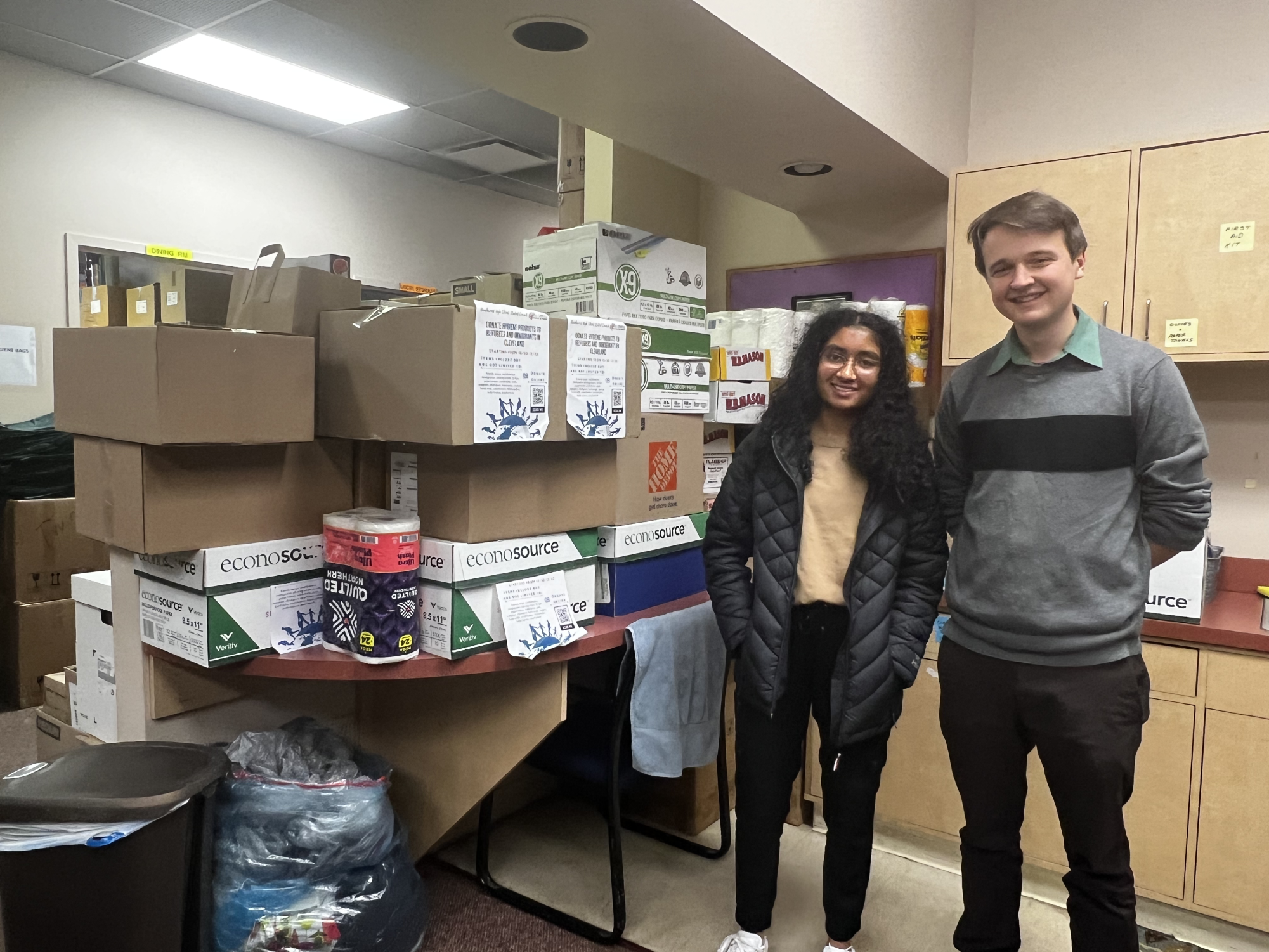 Student Council Vice President Shreya Chellu poses with USCRI Development Associate Graham Ball and the 2080 items collected.