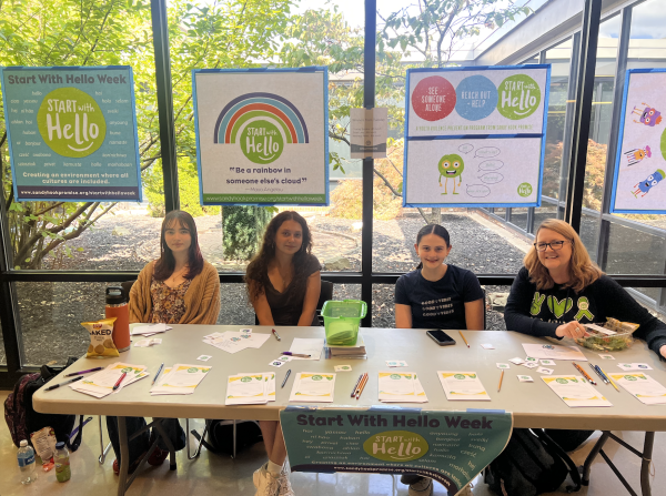 SAY club members Vega Craig, Sofiia Buldakova, Alma Saltzman and SAY Counselor Cindy Toncler greeted students during lunches. 