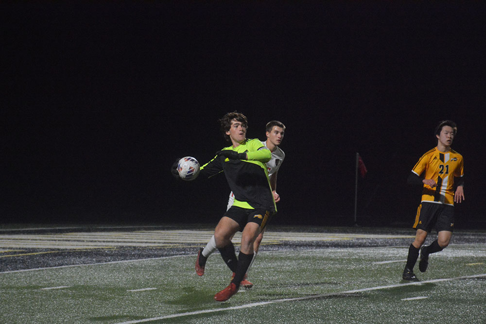 Senior goalkeeper, Josh Rosenblitt assertively throws the ball.