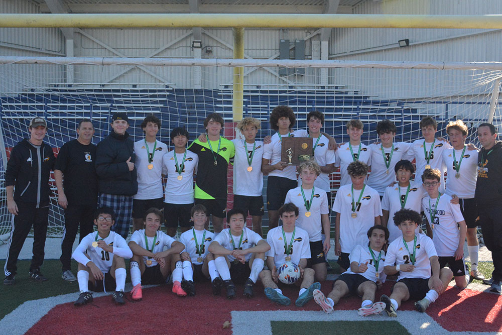 The Bison pose with their regional championship trophy, the first in school history. 