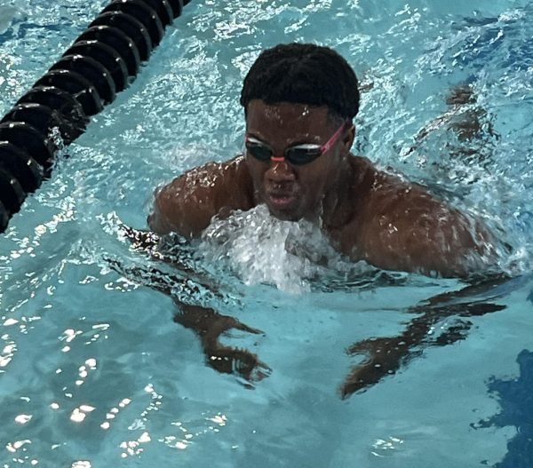 Senior Johnny Owens swims breastroke at practice in early December.