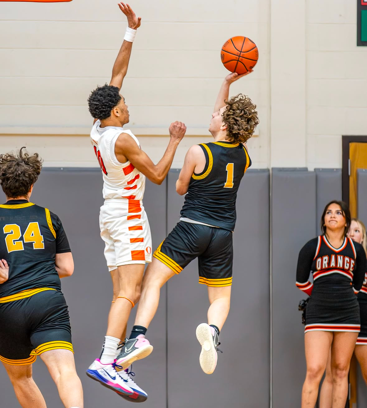 Senior guard Jacob Thomas attempts to shoot over an Orange defender. “The most challenging part was the mental aspect," Thomas said.