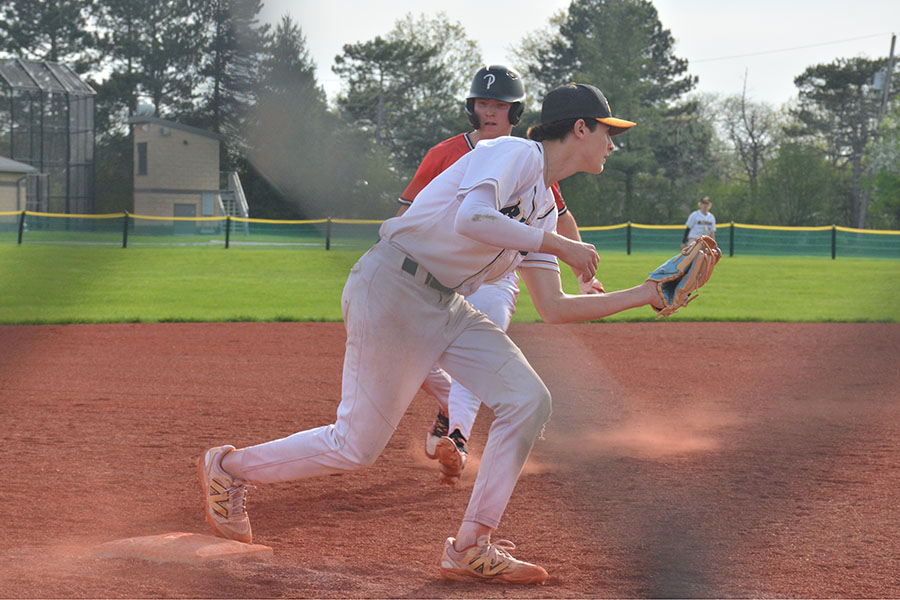 3rd baseman Gavi Lappen catches the ball, securing an out