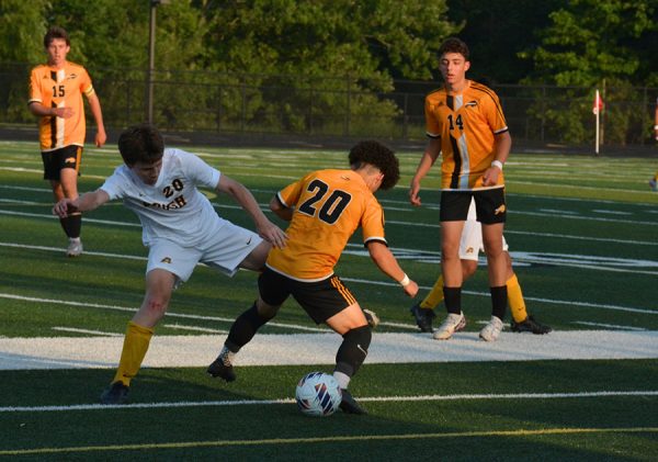 Sophomore Jose Agudelo fiercely defends the ball from a Brush player.