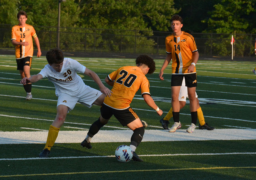 Sophomore Jose Agudelo fiercely defends the ball from a Brush player.