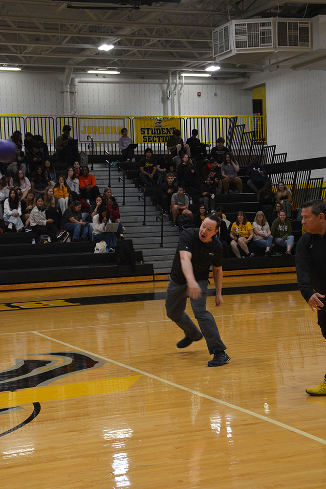 Principal Paul Chase launches a rocket. 