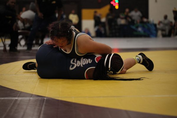 Nyla White pins an opponent from Solon at the Brush Invitational on Dec. 7.