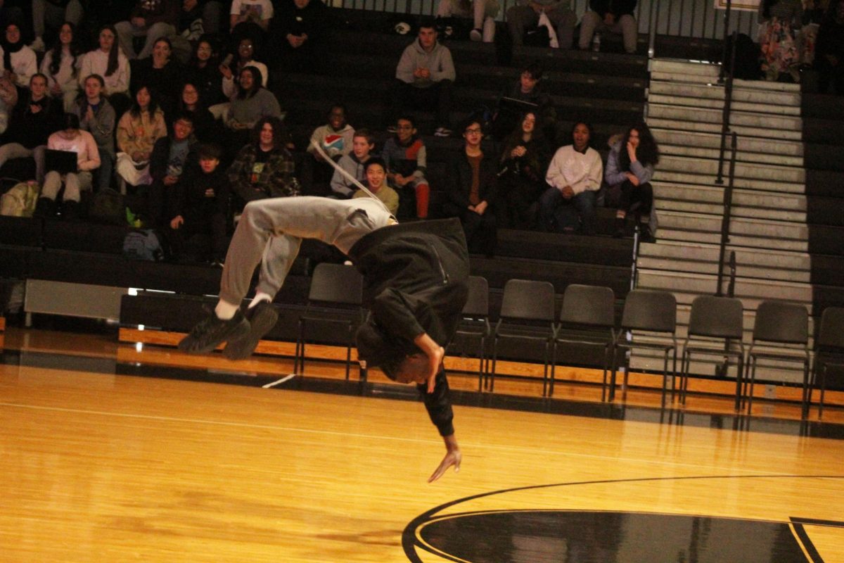 Juinor Diez Williams  of the Spirit Squad shows off his impressive tumbling skills.
