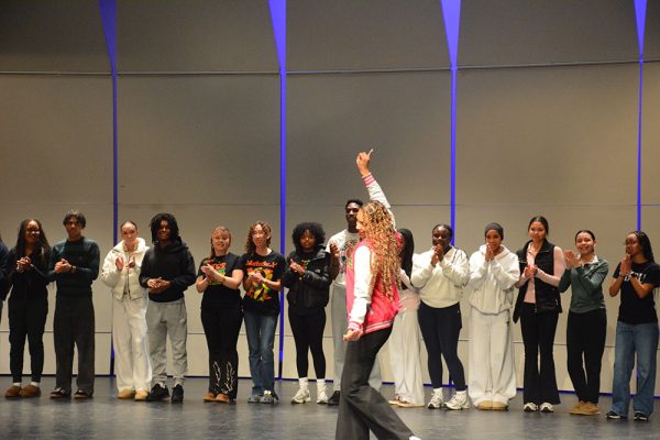 Asst. Principal Aubrei Watson demonstrates the AKA stroll at the Black History Month assembly.