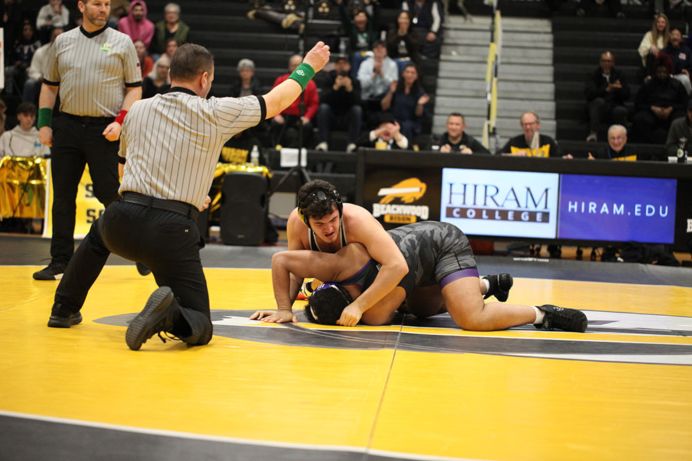 Senior Mayer Bergman hits a reversal on his Lakewood opponent at the 215 lb. weight class.