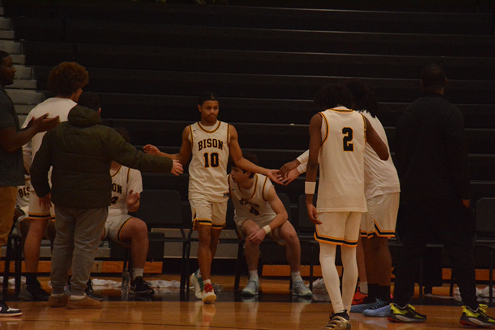 Sophomore Dylan Paul walks out on the court, ready to start the game