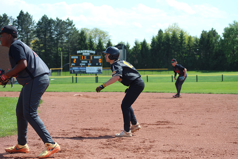 Eli Ward scans the field for perfect moment to run to second base