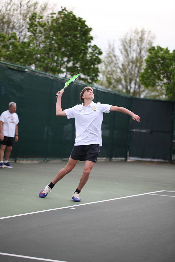 Ido Rub returns a high ball. 